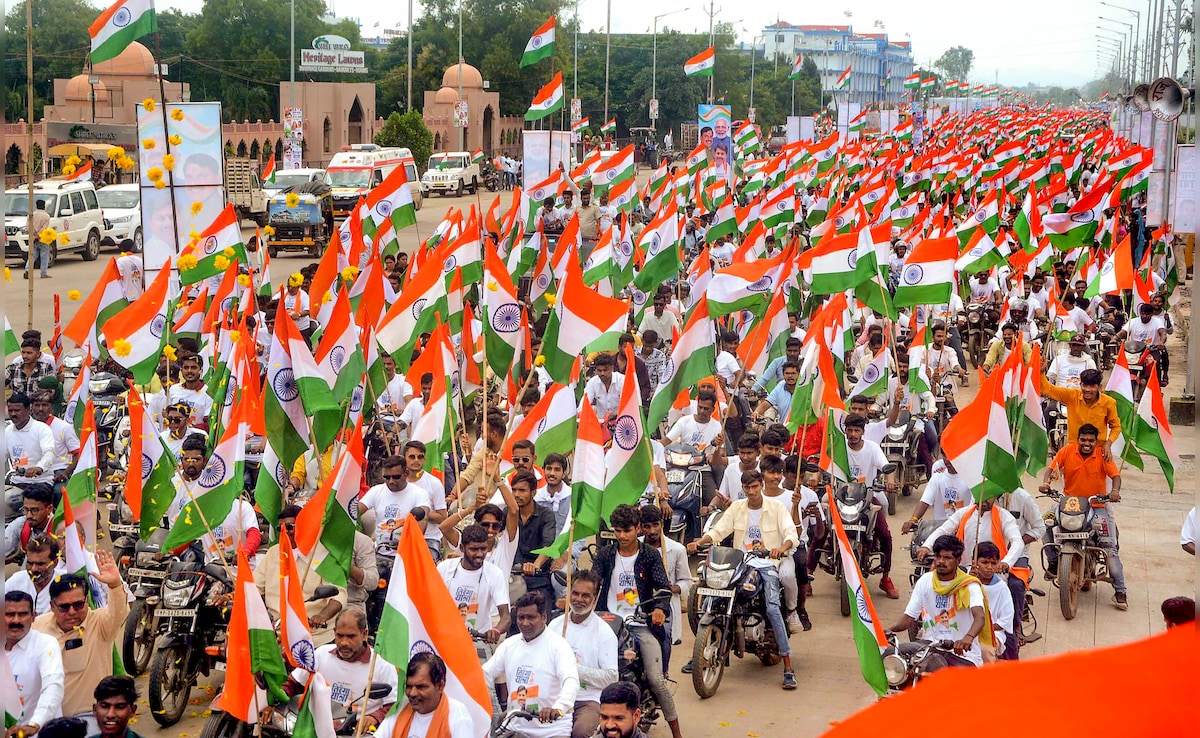 People take part in a Tiranga Yatra on the eve of Independence Day, in Bhopal