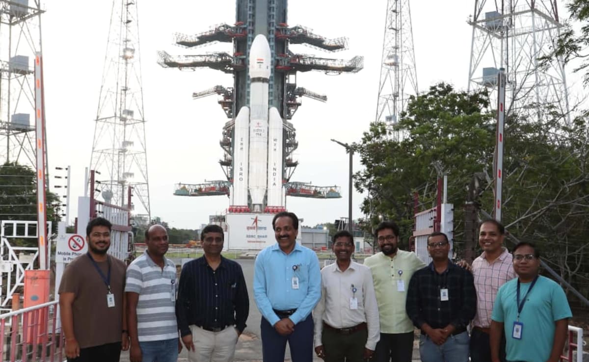 Chandrayaan-3 science team with Chiarman Dr S Somanath at Sriharikota with the Launch Vehicle Mark-3 in the backdrop