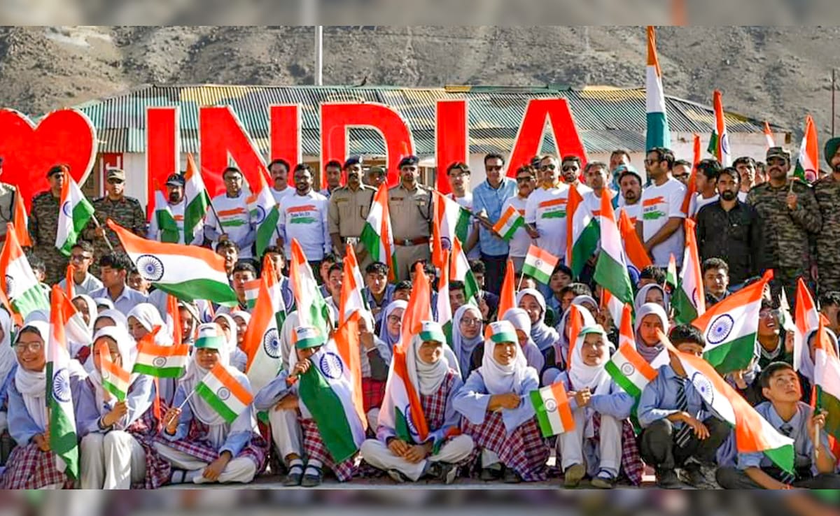 Students take part in a Tiranga Rally on the eve of Independence Day, in Kargil