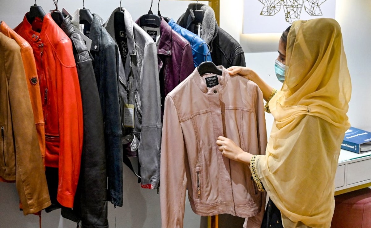 Anum Shahzadi sorts jackets at a leather factory in Karachi