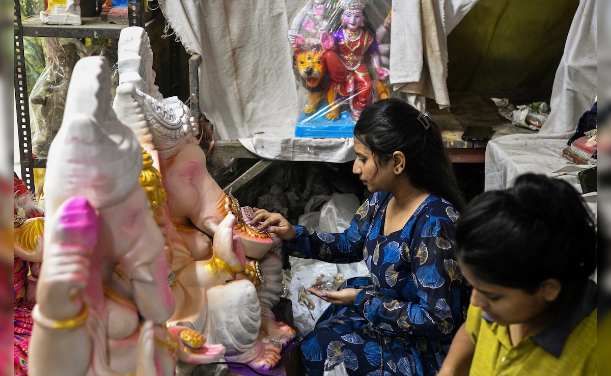 Idols of Lord Ganesha being given a final touch on the first day of ten-day long Ganesh Chaturthi festival, in New Delhii