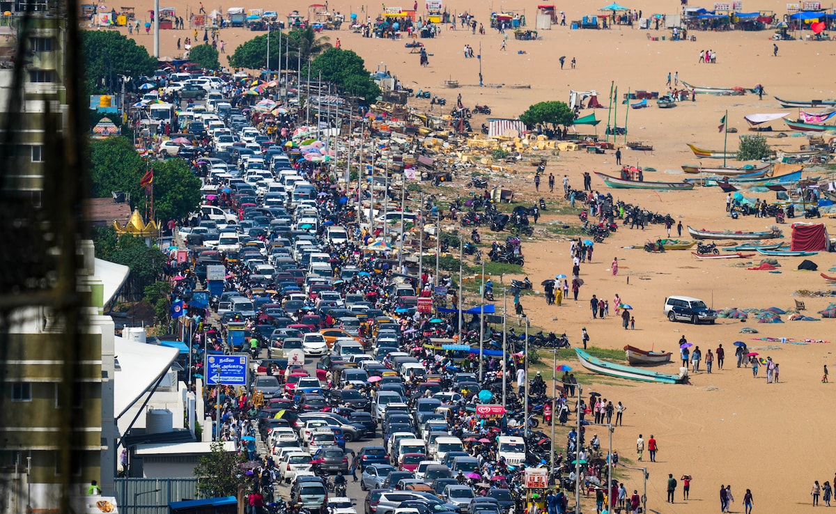 Traffic jam on a road as people leave after witnessing the Indian Air Forces (IAF) air show at Marina Beach in Chennai